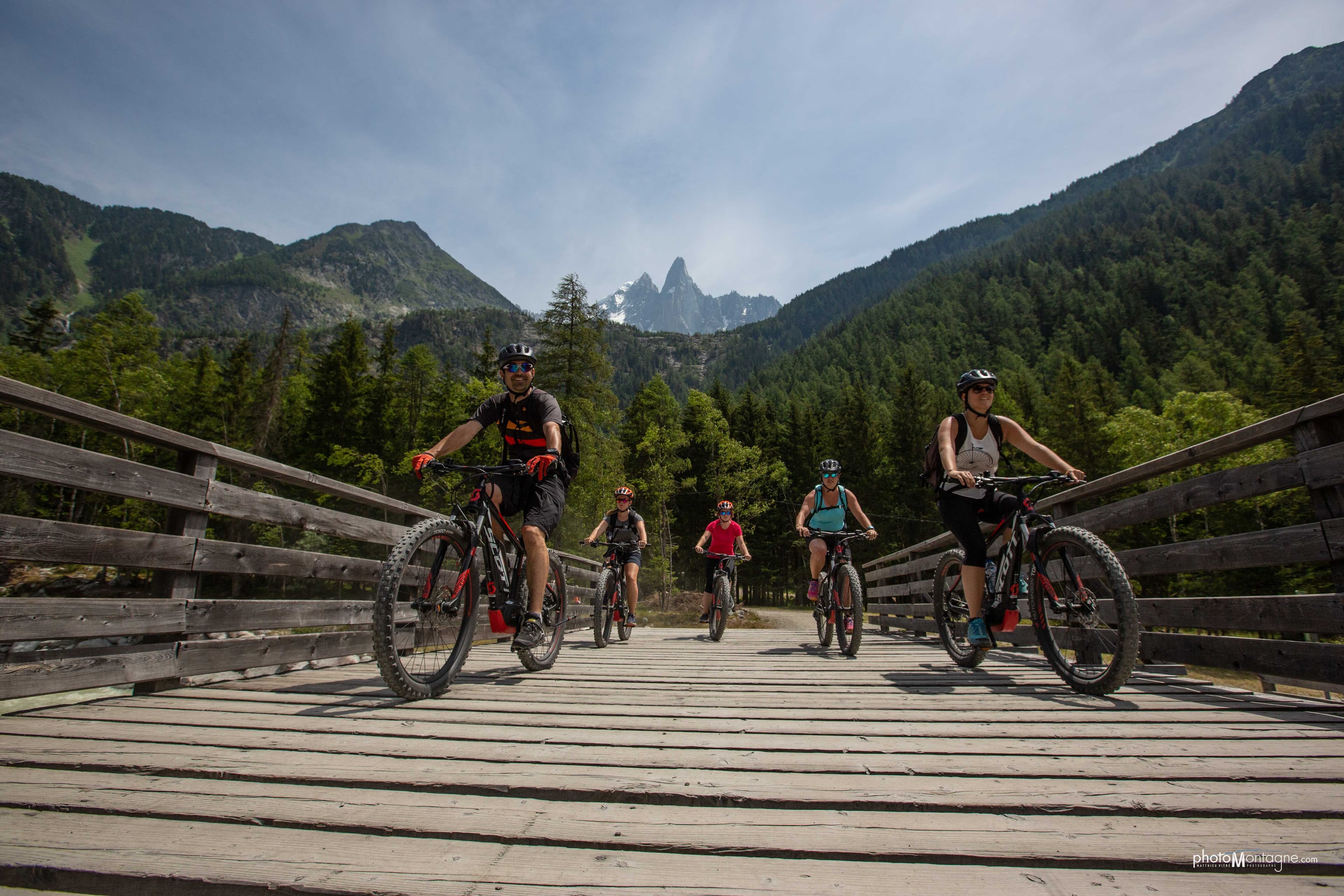 E-bike rider exploring alpine meadows in Chamonix valley with Mont Blanc in the background